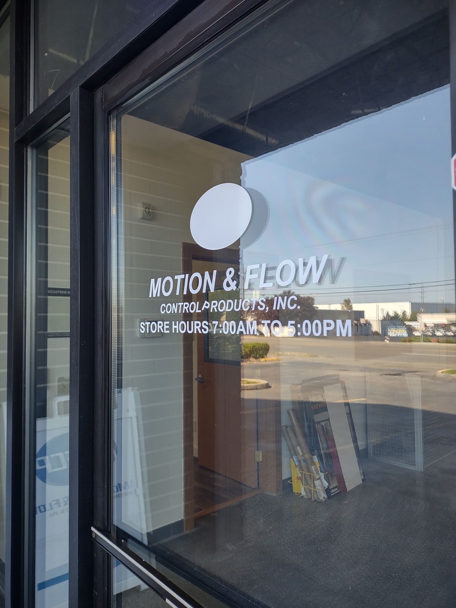 Glass door with the white text 