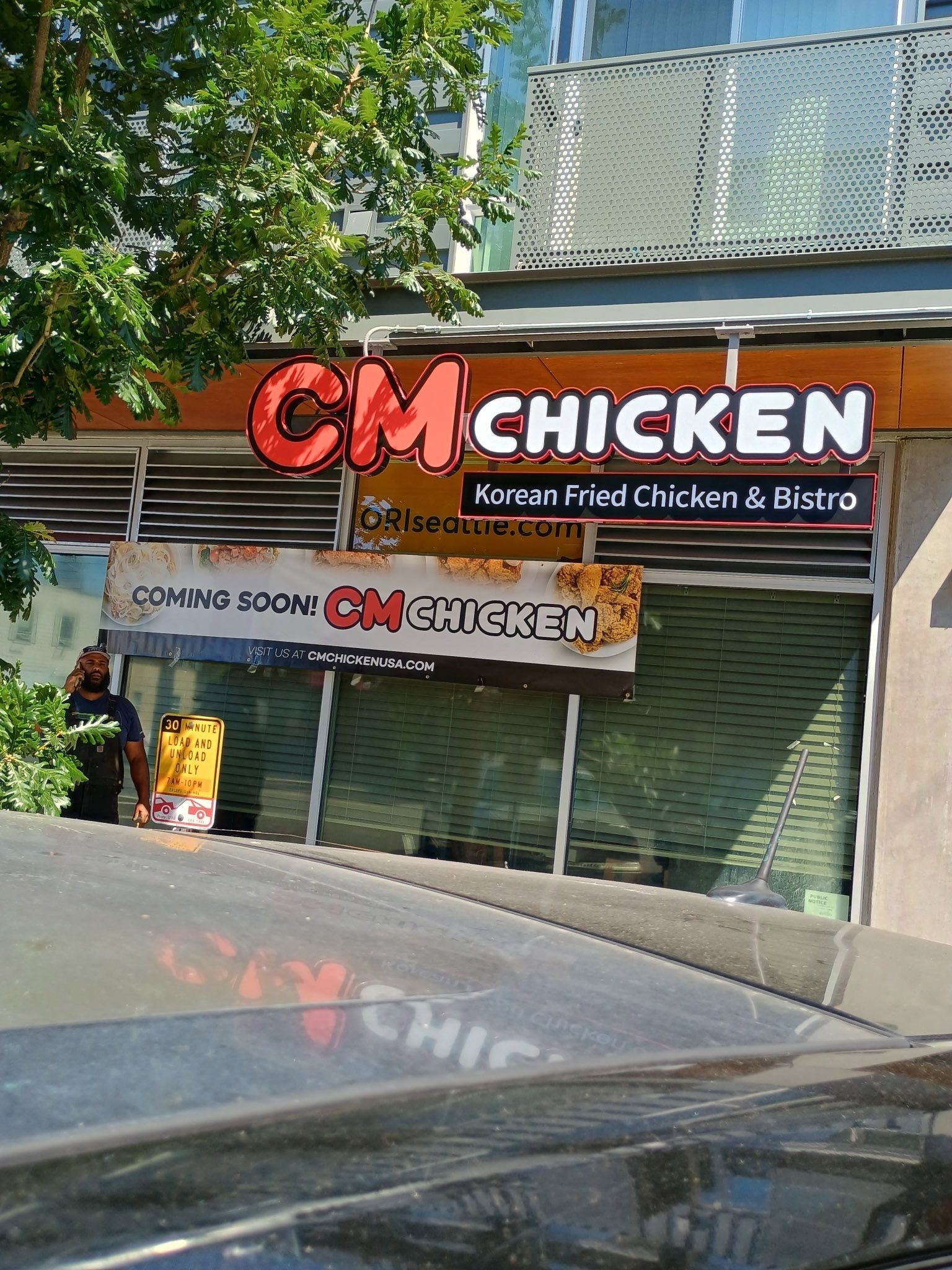 A storefront for CM Chicken, a Korean fried chicken restaurant, with a 