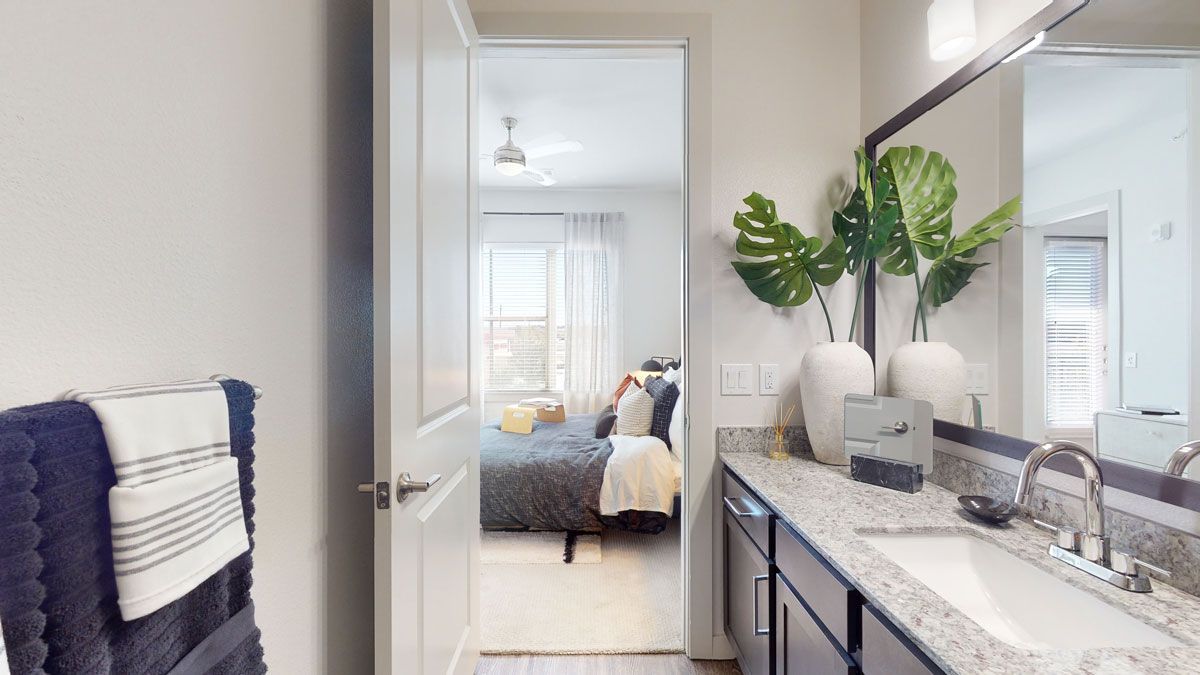 bright modern bathroom with granite countertops