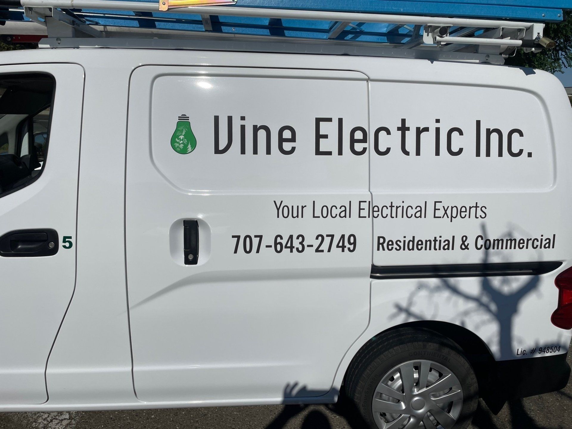 A white van with vine electric inc. written on it