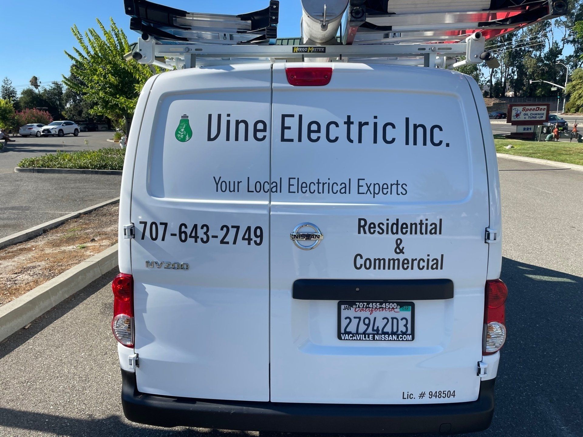 A vine electric inc. van is parked in a parking lot