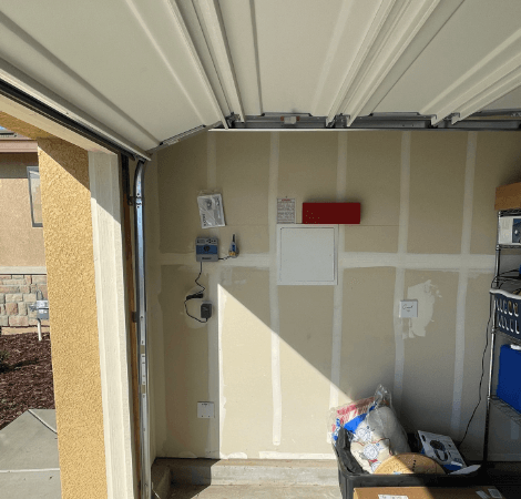 The inside of a garage with the door open