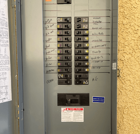 A electrical panel with a warning label on it