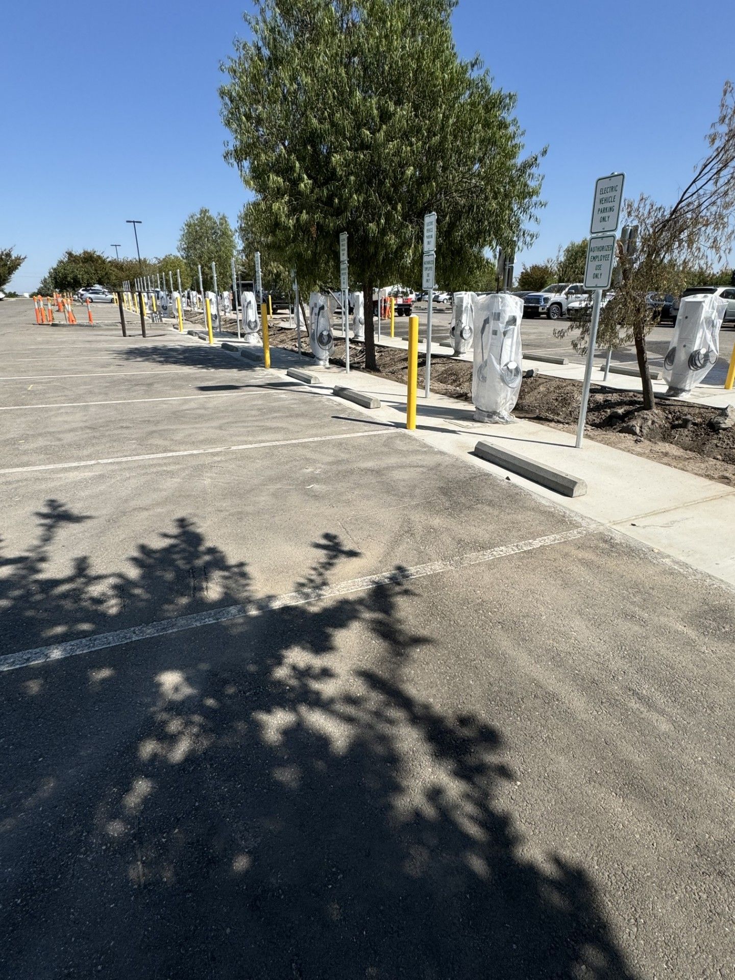 A row of charging stations in a parking lot