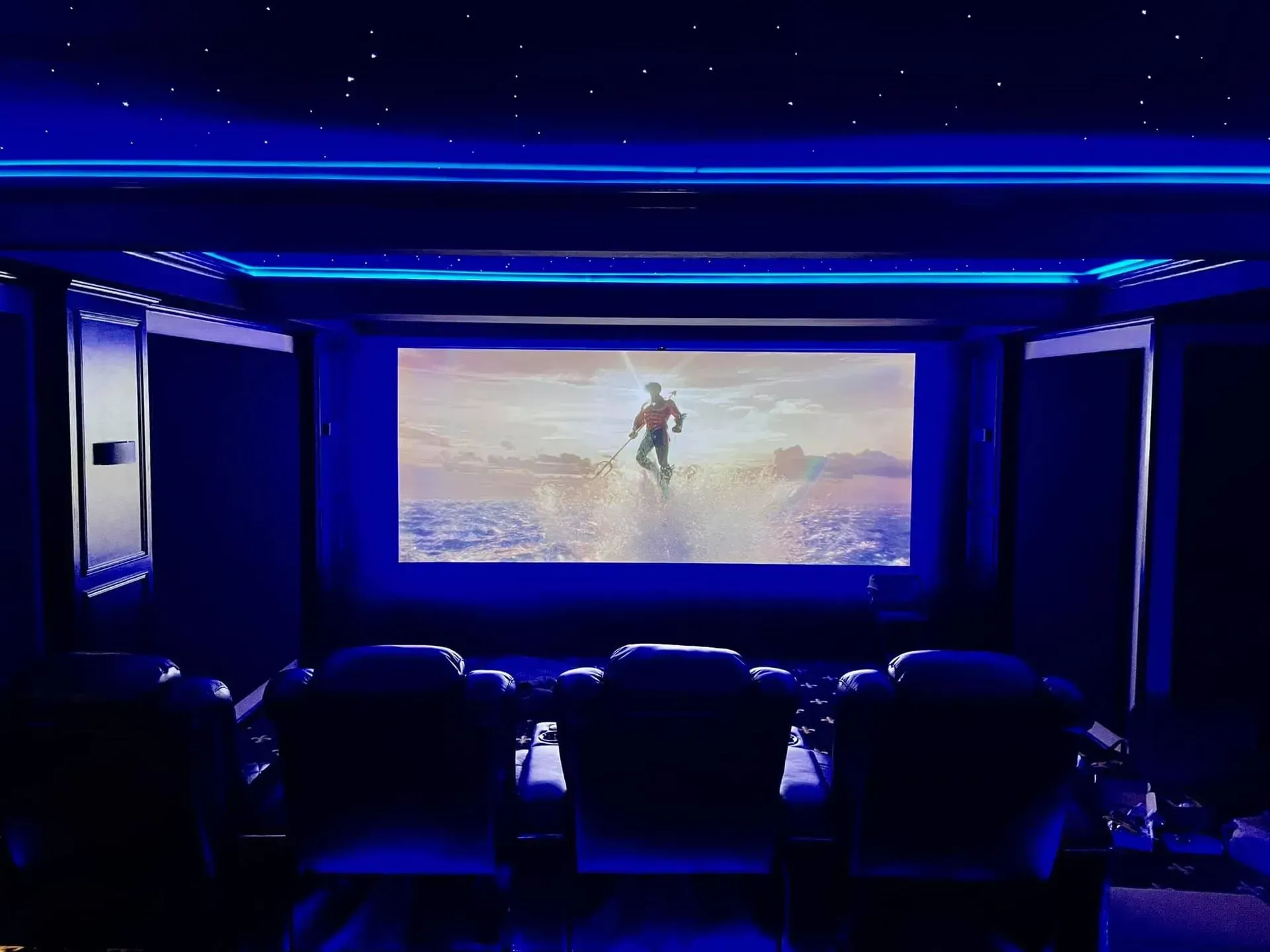 A row of brown leather seats in a theater