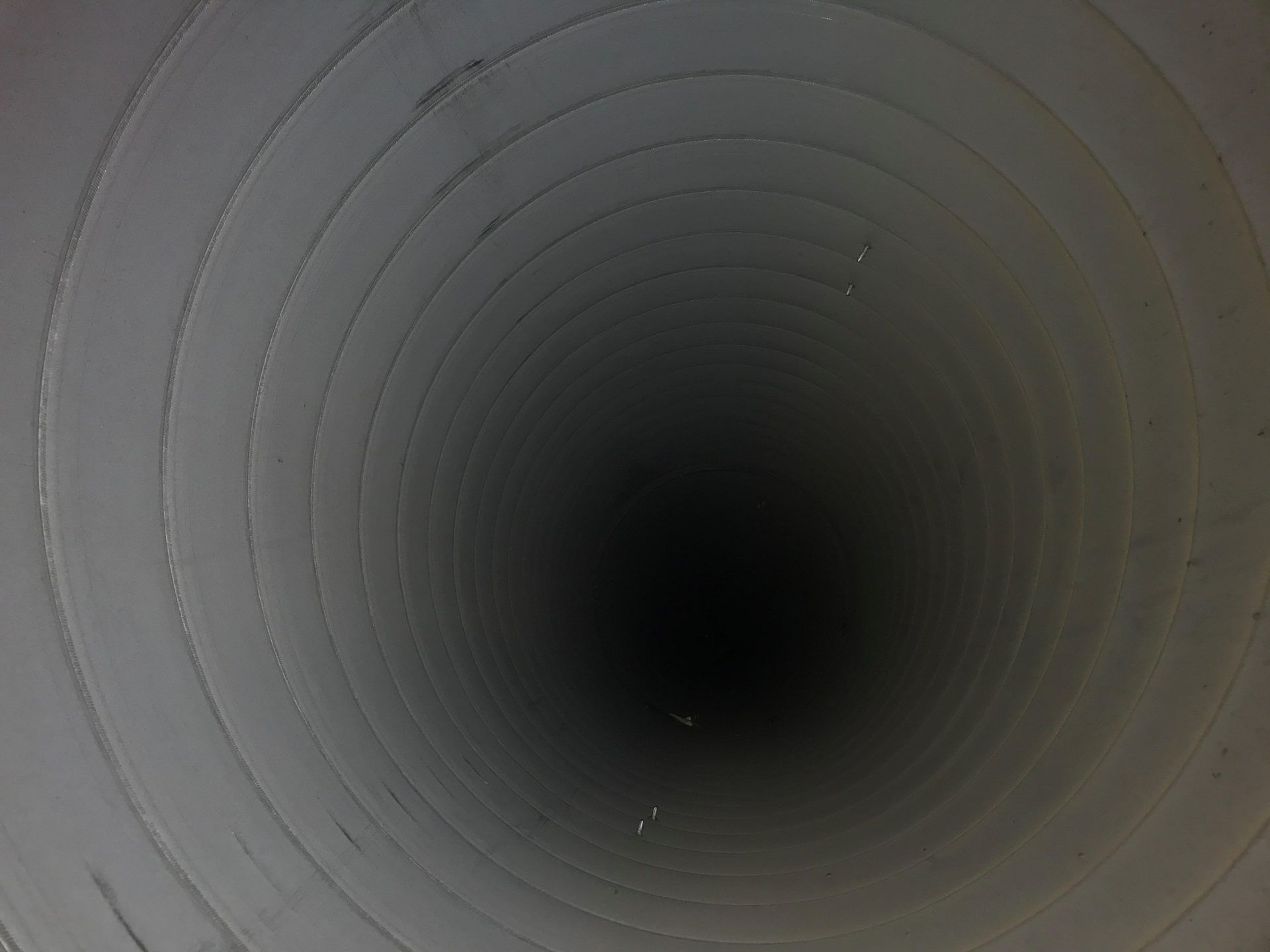 A Close Up Of The Inside of A Tunnel with A Dark Circle in The Middle | S. Glens Falls, NY | Performance Industrial