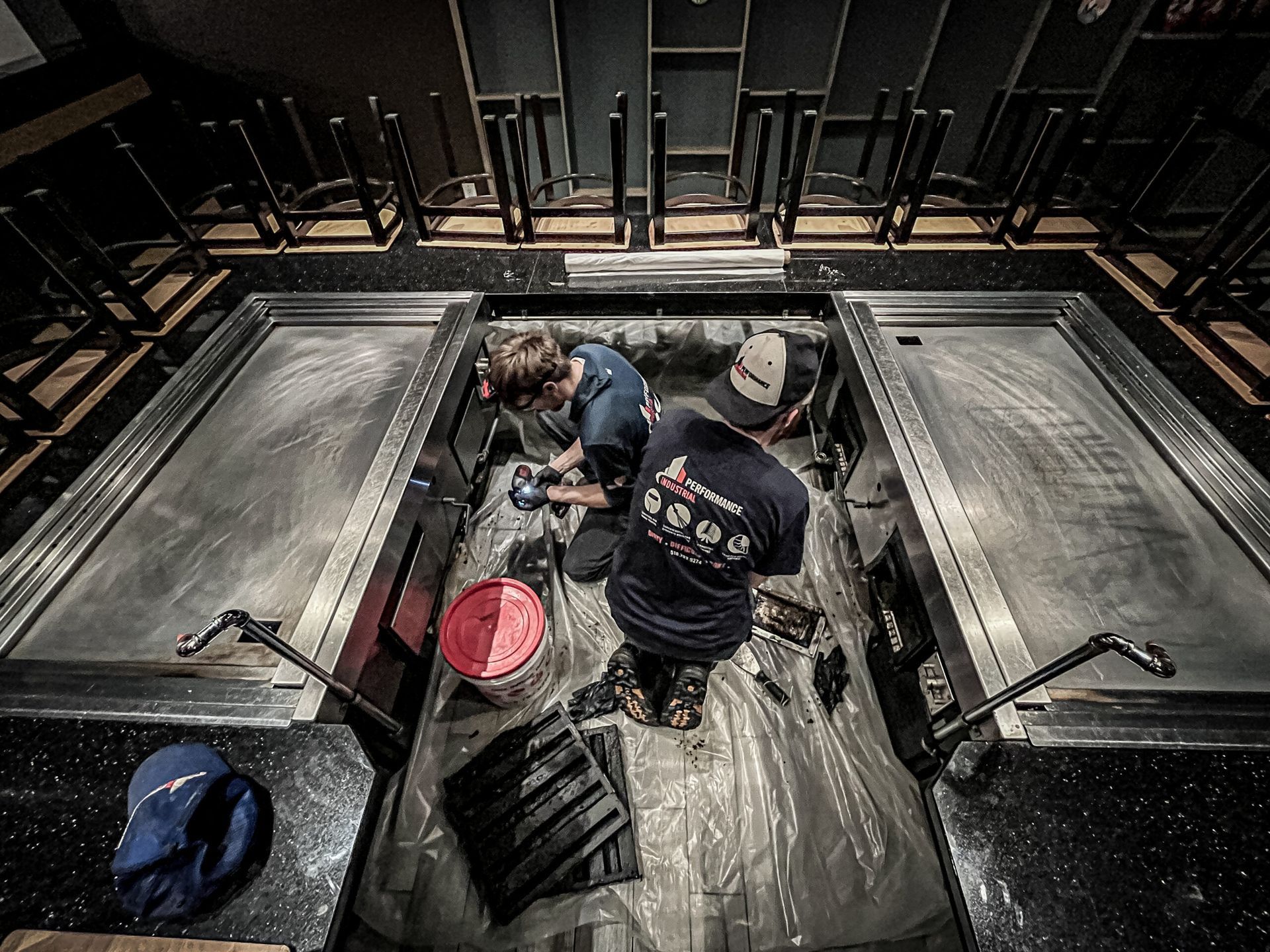 Two Men Are Working on A Bar in A Restaurant | S. Glens Falls, NY | Performance Industrial