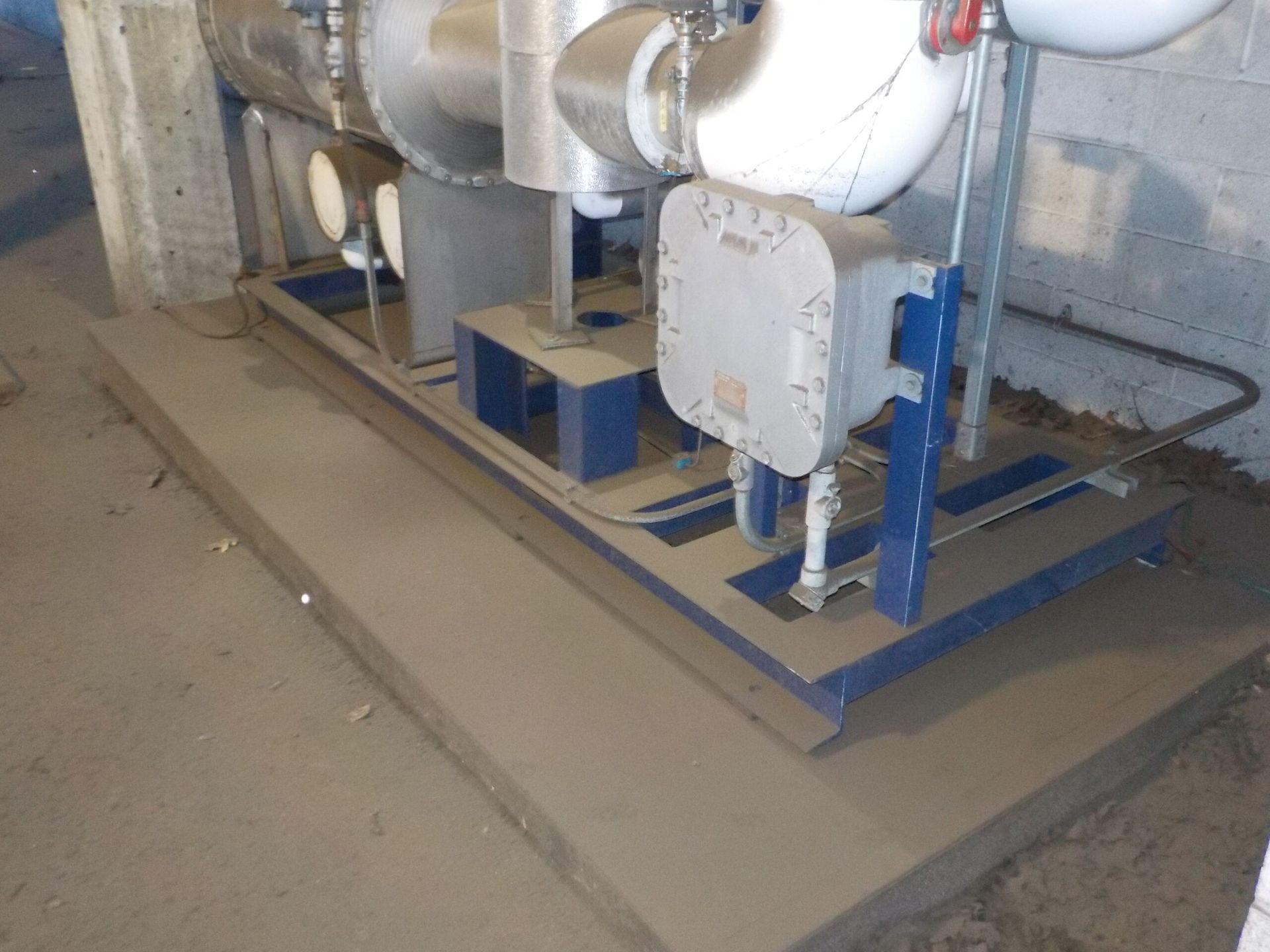 A Machine Is Sitting on A Dirty Floor in A Room | S. Glens Falls, NY | Performance Industrial