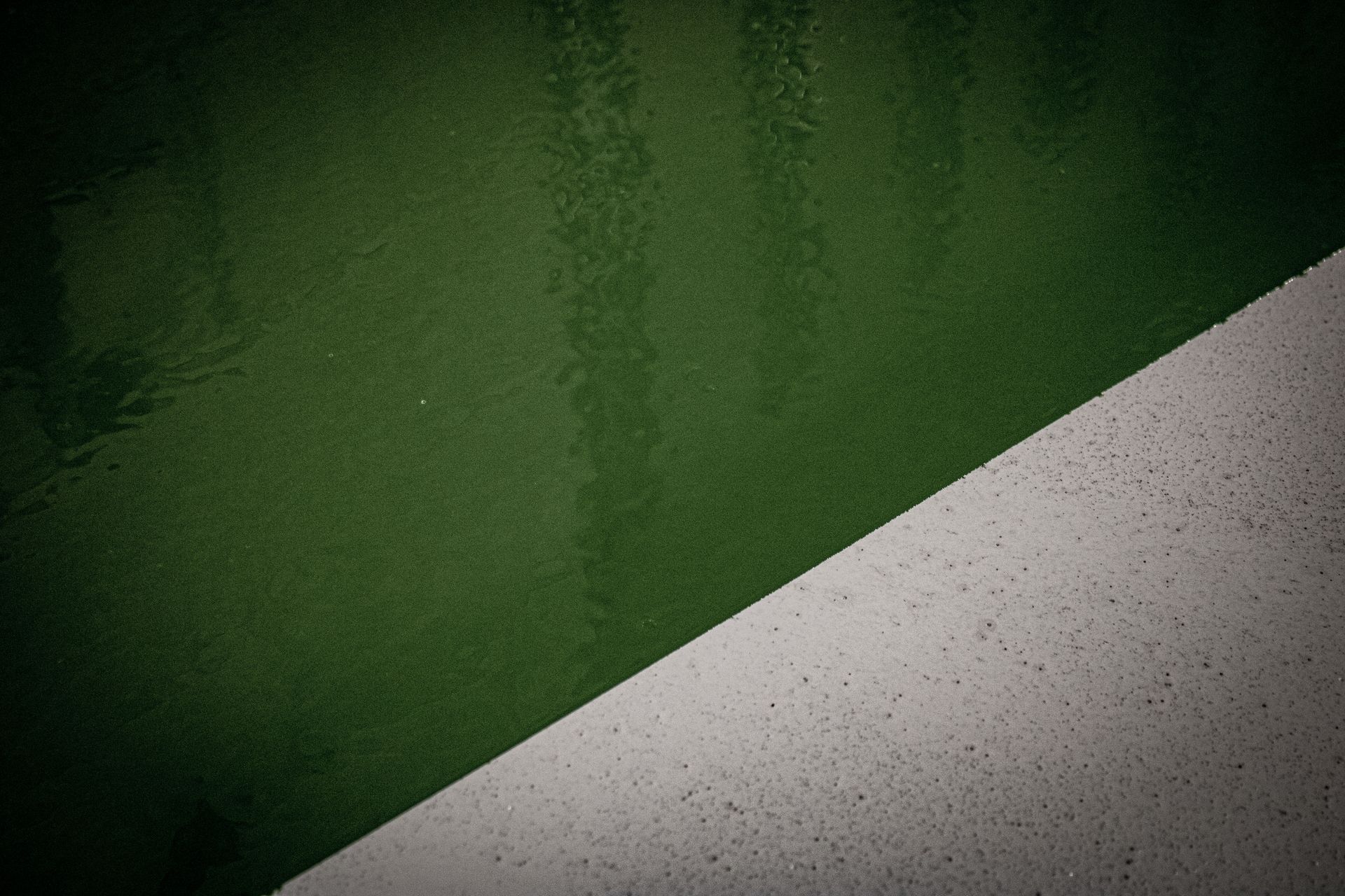 A green and white background with a diagonal line.