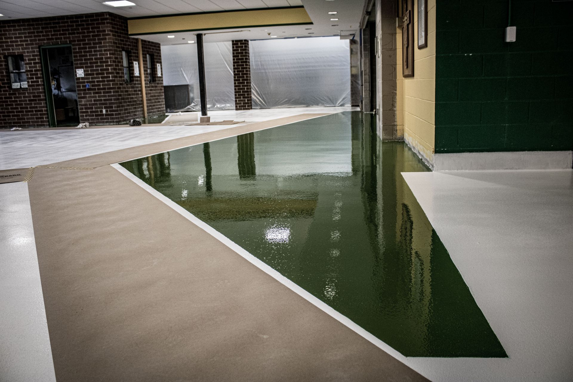 A large room with a swimming pool in the middle of it