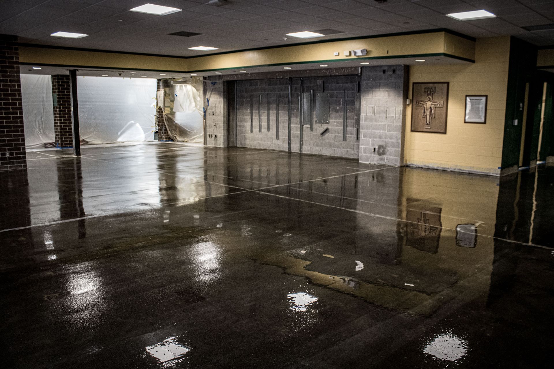An empty room with a reflection of a building in the floor