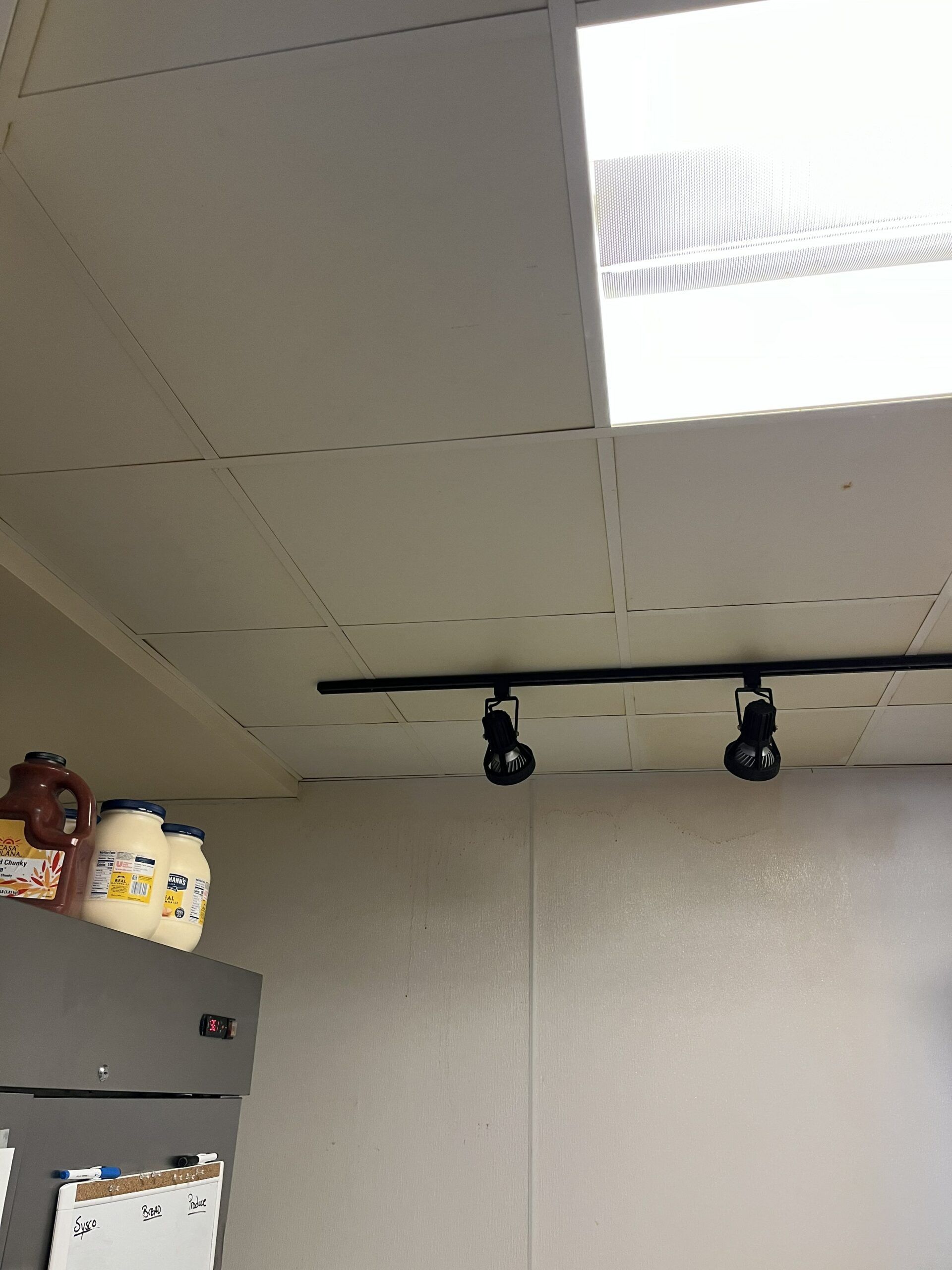 A room with a ceiling that has a light on it