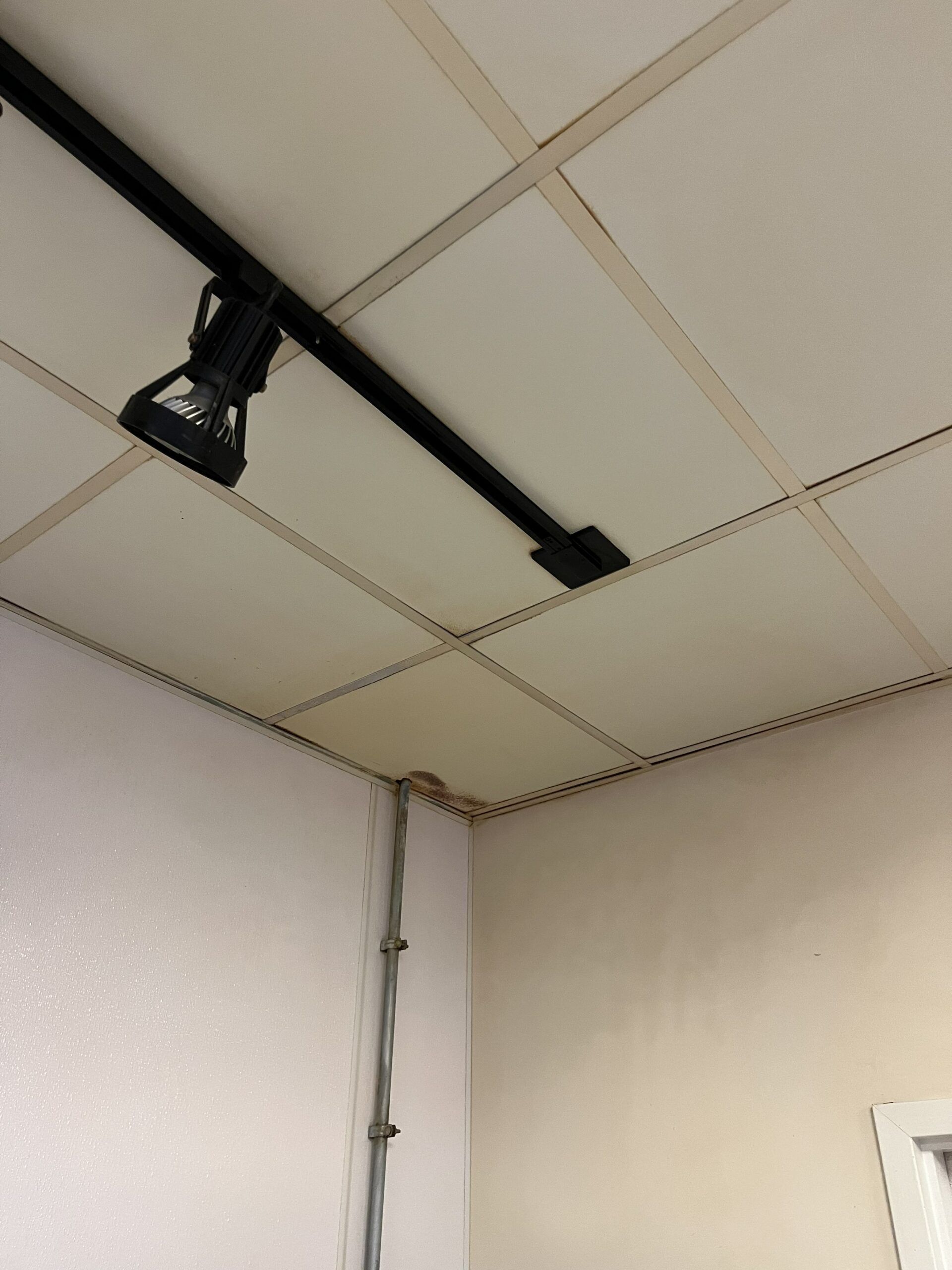 A light is hanging from the ceiling of a room