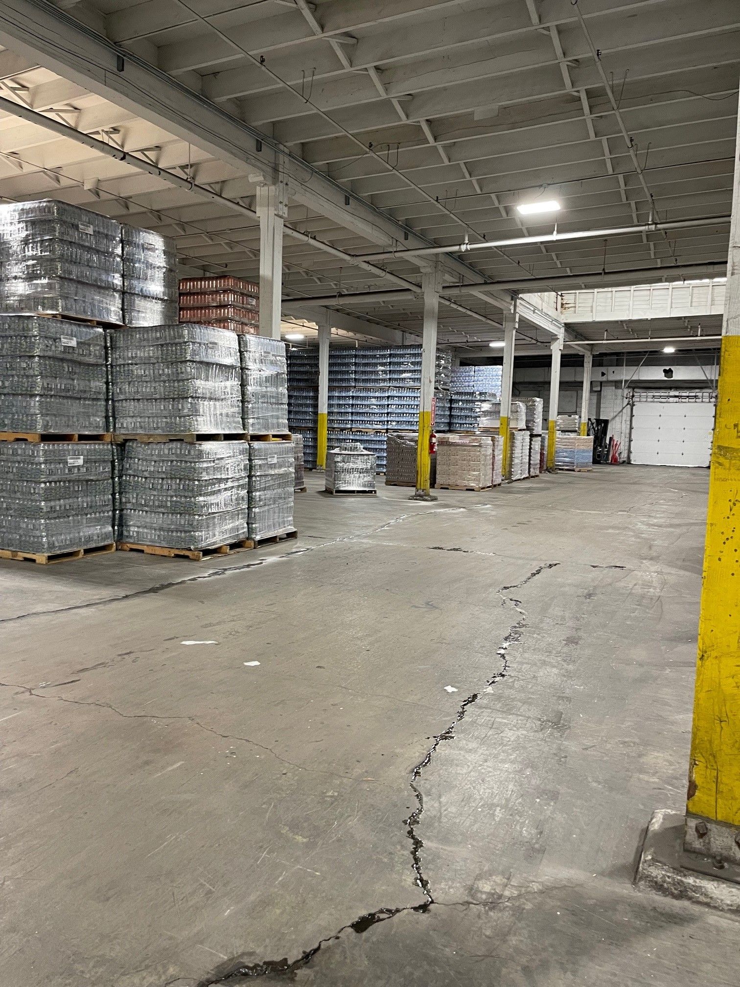 A Large Warehouse Filled with Lots of Pallets and Boxes | S. Glens Falls, NY | Performance Industrial