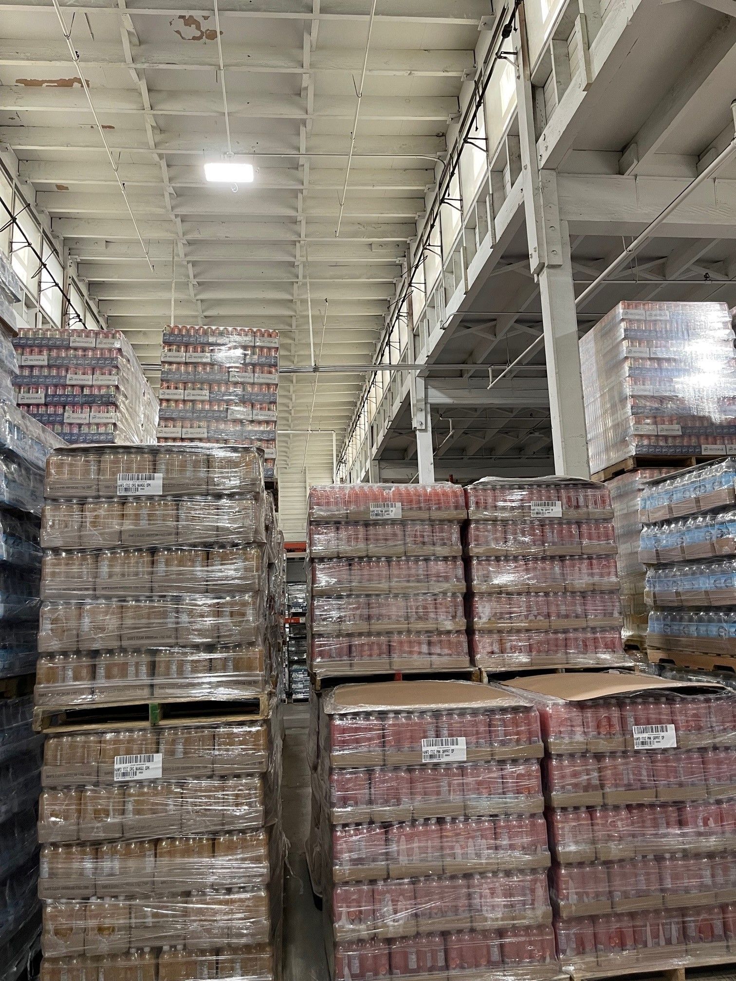 A Large Warehouse Filled with Lots of Cans and Bottles | S. Glens Falls, NY | Performance Industrial