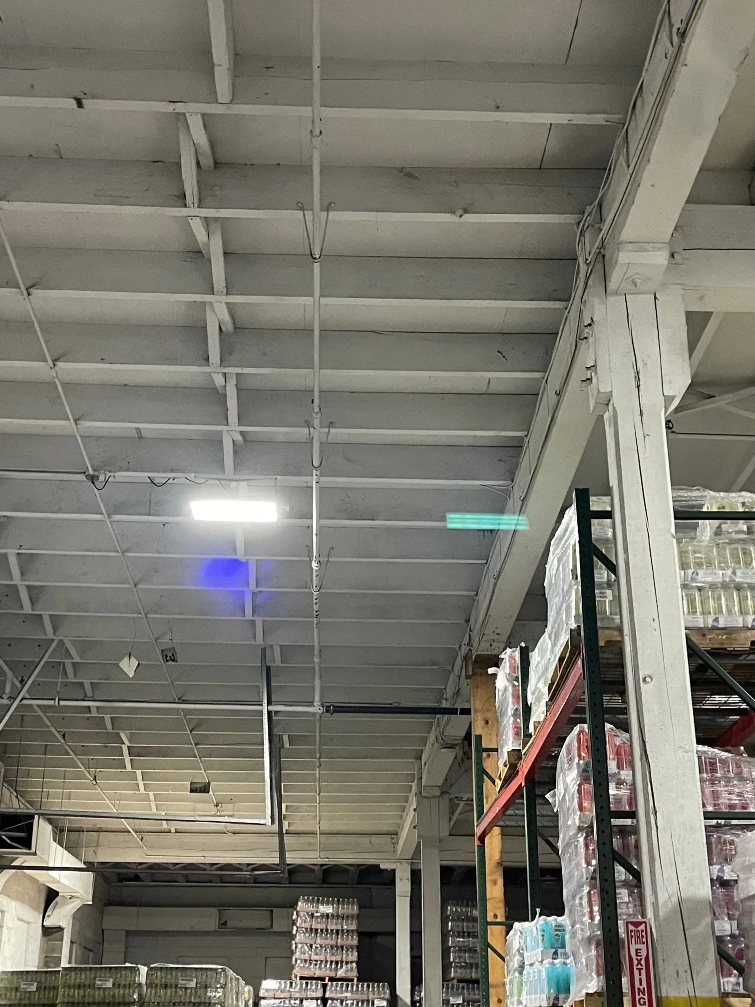 A large warehouse filled with lots of boxes of toilet paper.