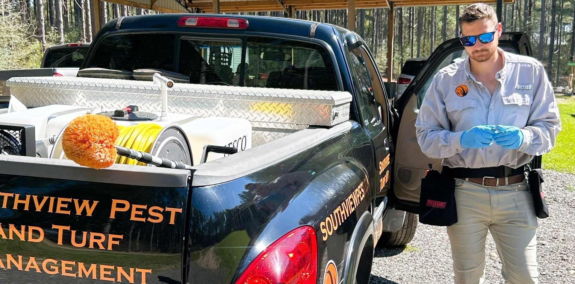 A cockroach is crawling on the floor of a kitchen.