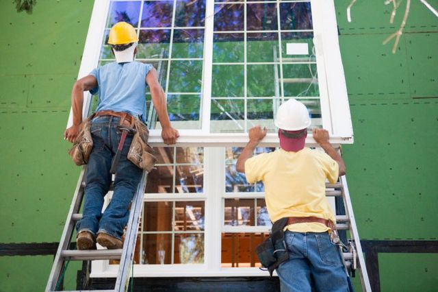 Men fixing windows — About Anaheim Screen & Glass in Anaheim, CA