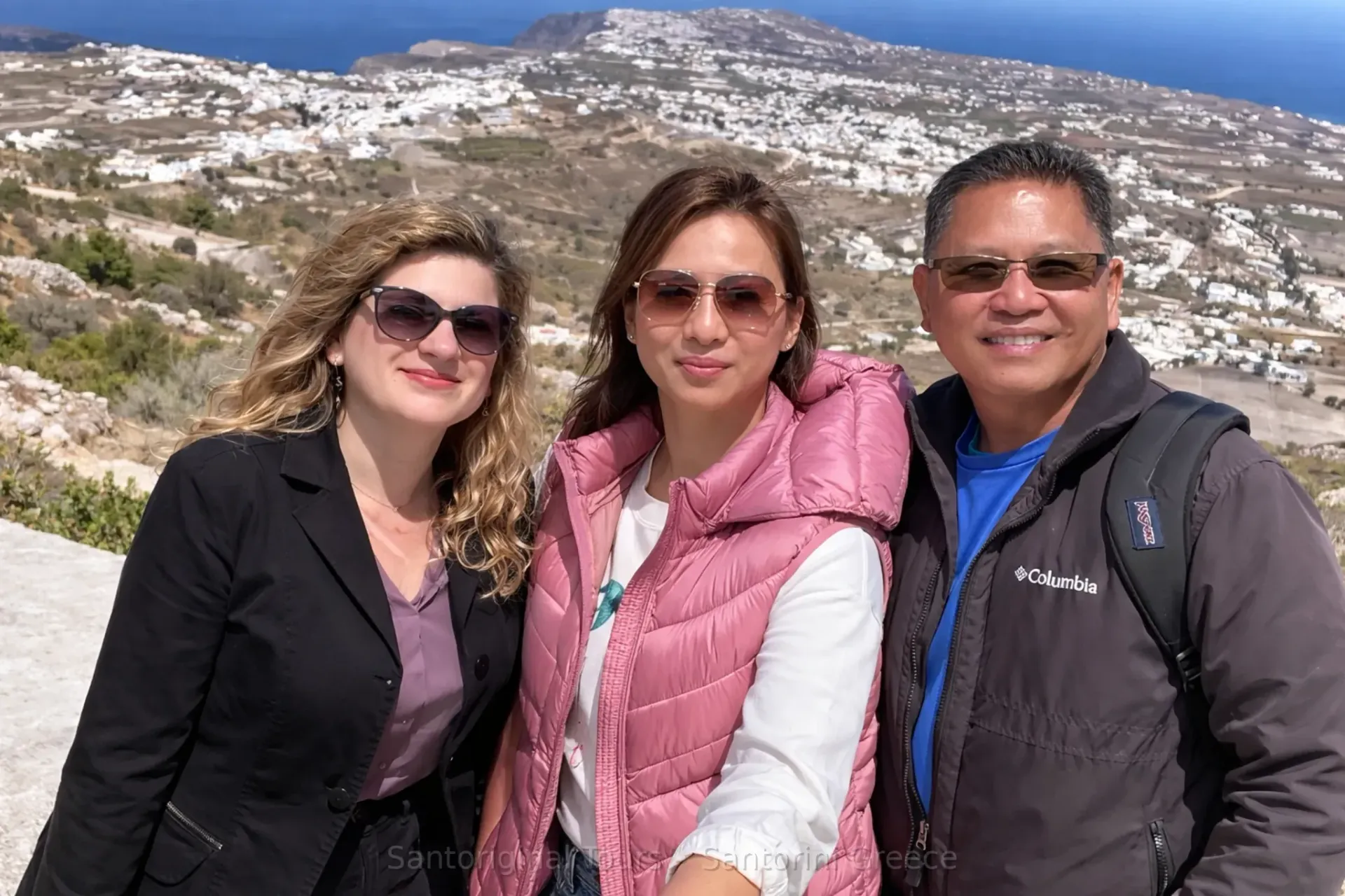 Aphrodite Santoriginal guide with guests at a Santorini viewpoint