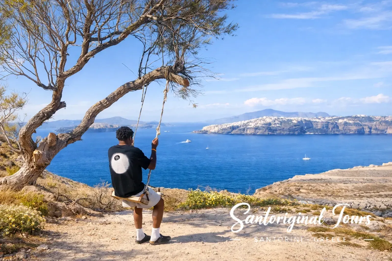 Guest enjoying a quiet caldera viewpoint during a private tour in Santorini