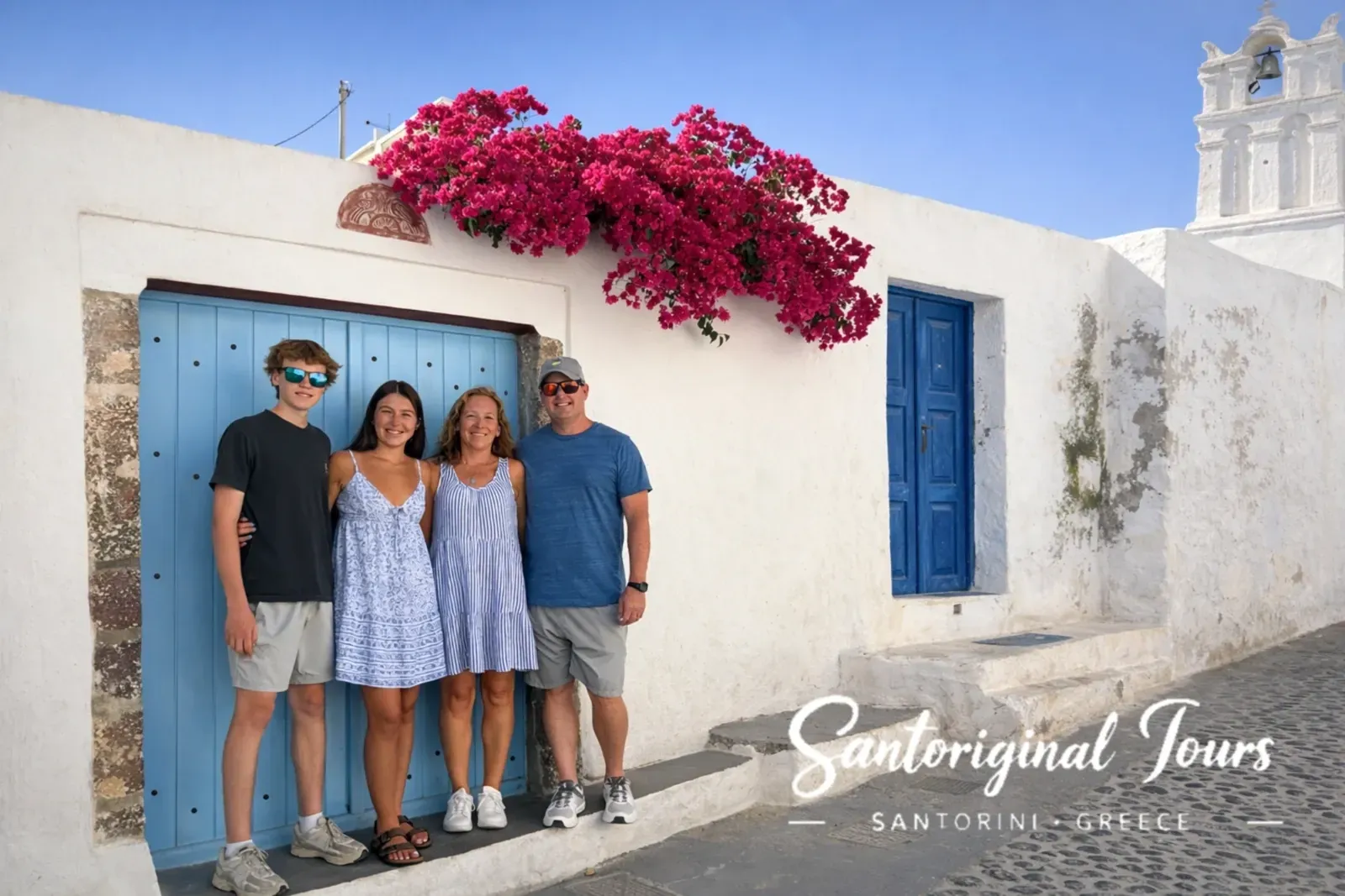 Family photo stop during a private tour in Santorini village
