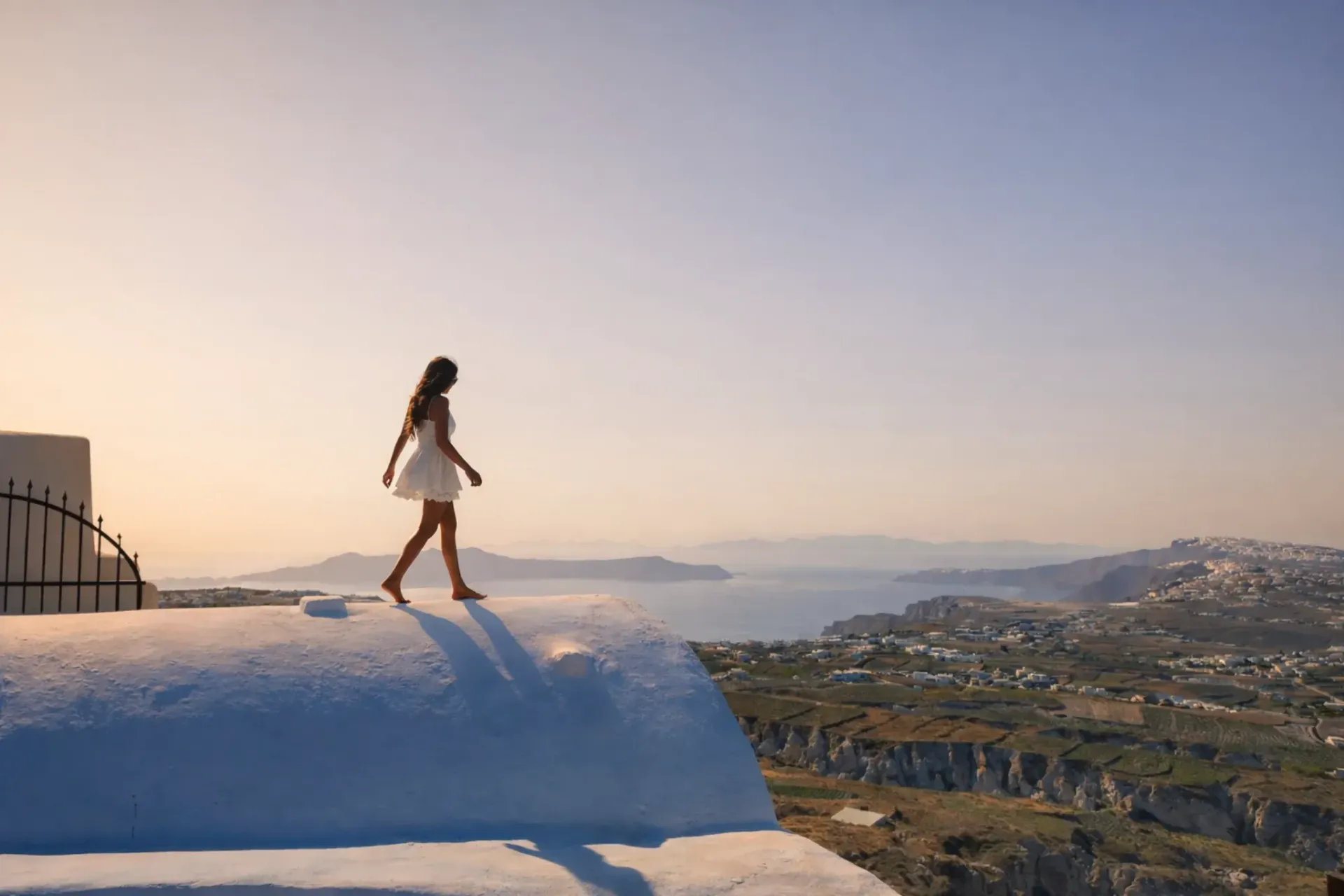 Woman enjoying a Santorini viewpoint during a private tour