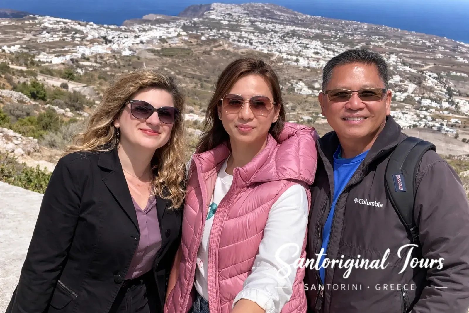 Aphrodite Santoriginal guide with guests at a Santorini viewpoint