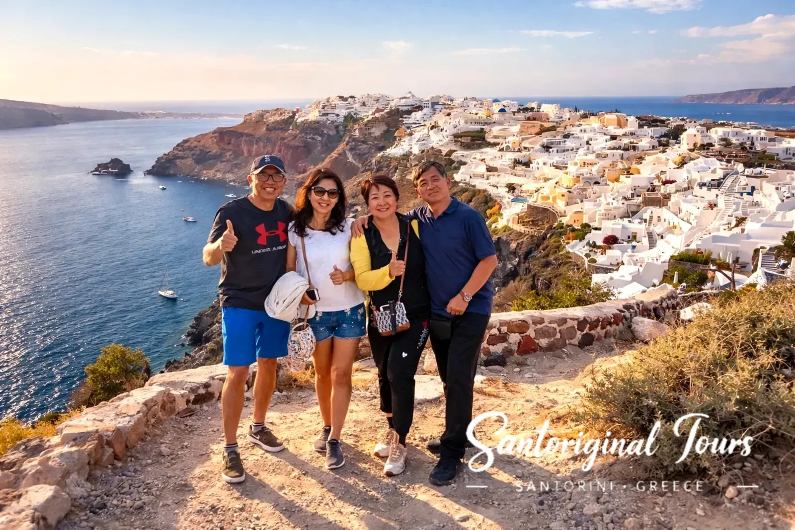 Our guests on a private tour in Santorini overlooking Oia and the caldera