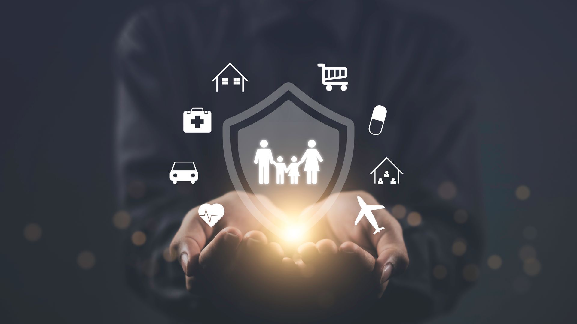 Hands holding a glowing light with insurance icons around a family shield. Hands holding a glowing light with insurance icons around a family shield.