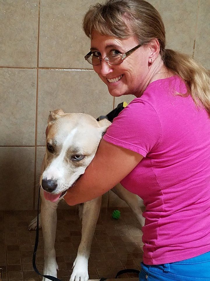 women standing with dog