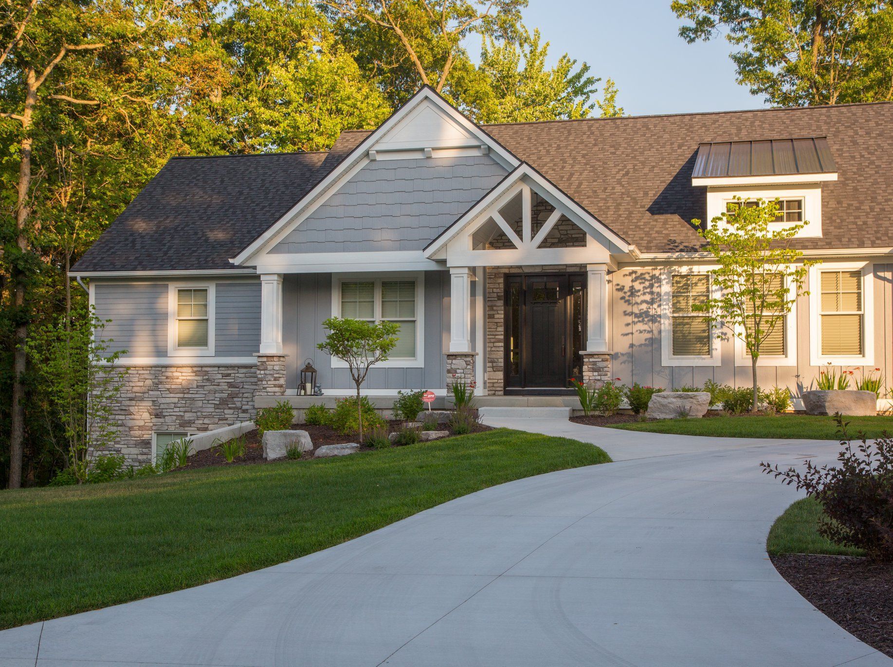 A large house with a driveway leading to it