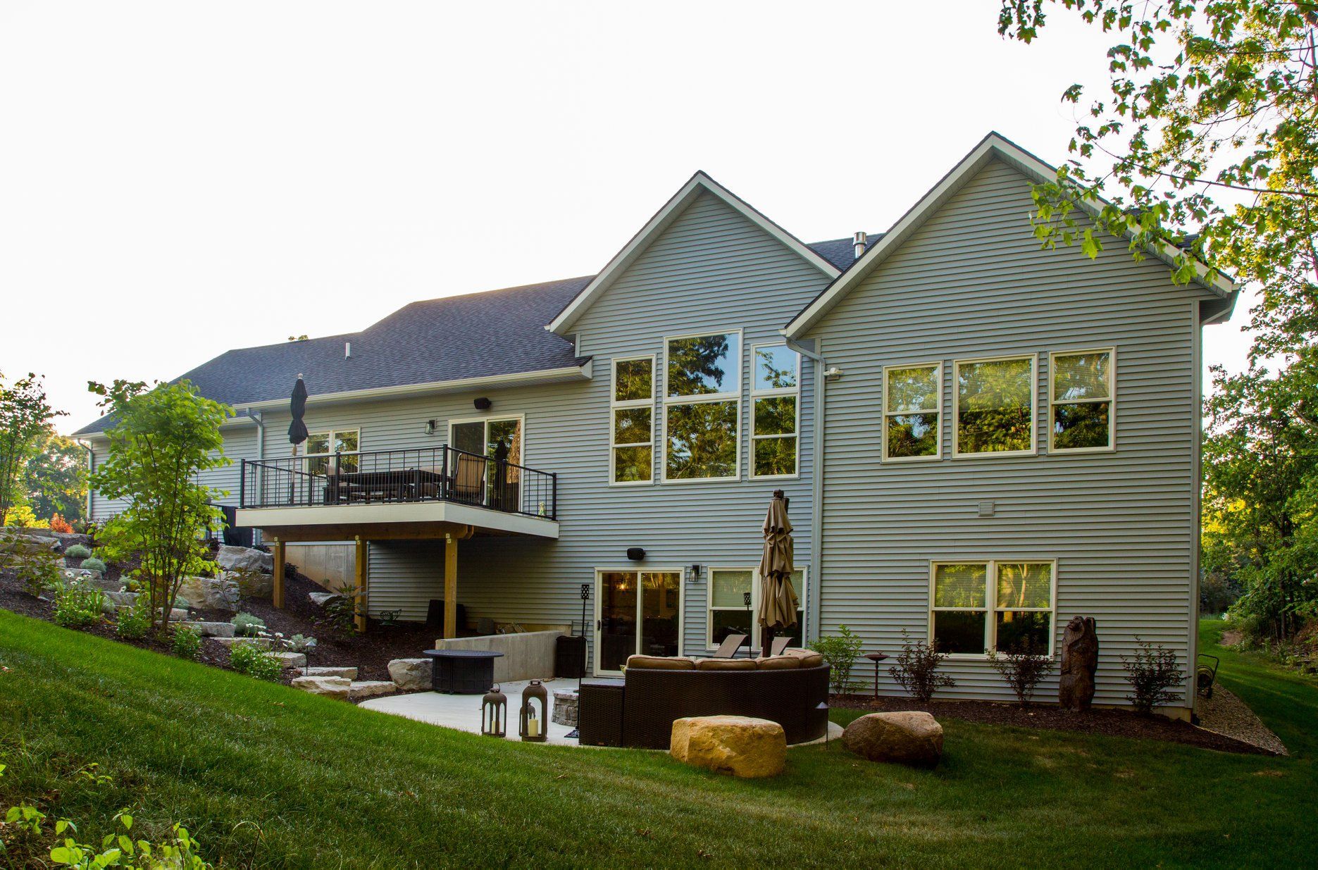 A large house with a lot of windows and a large deck