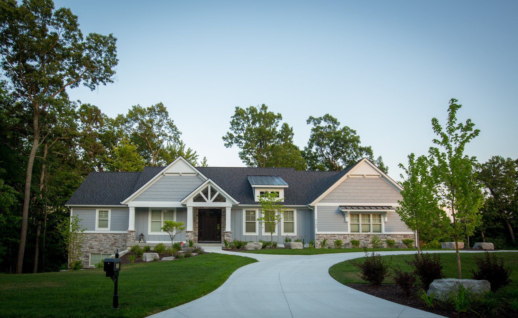 A large house with a driveway leading to it
