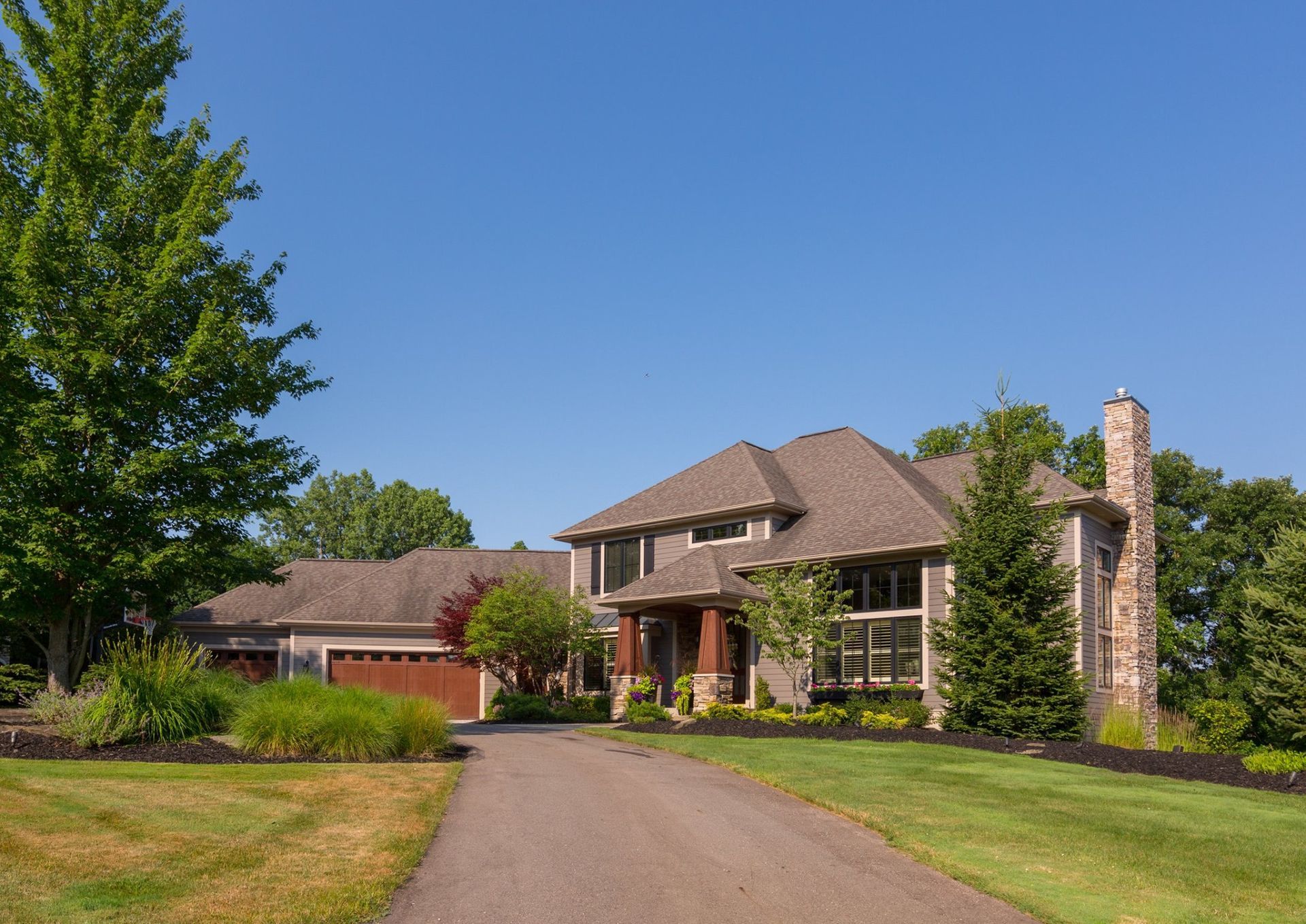 A large house with a driveway leading to it