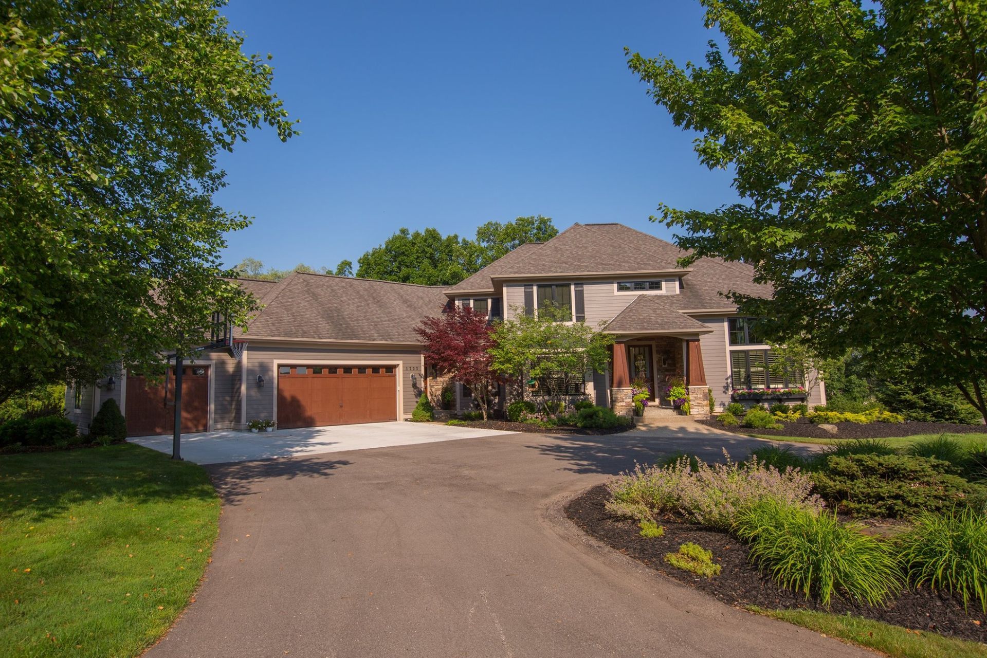A large house with a driveway leading to it