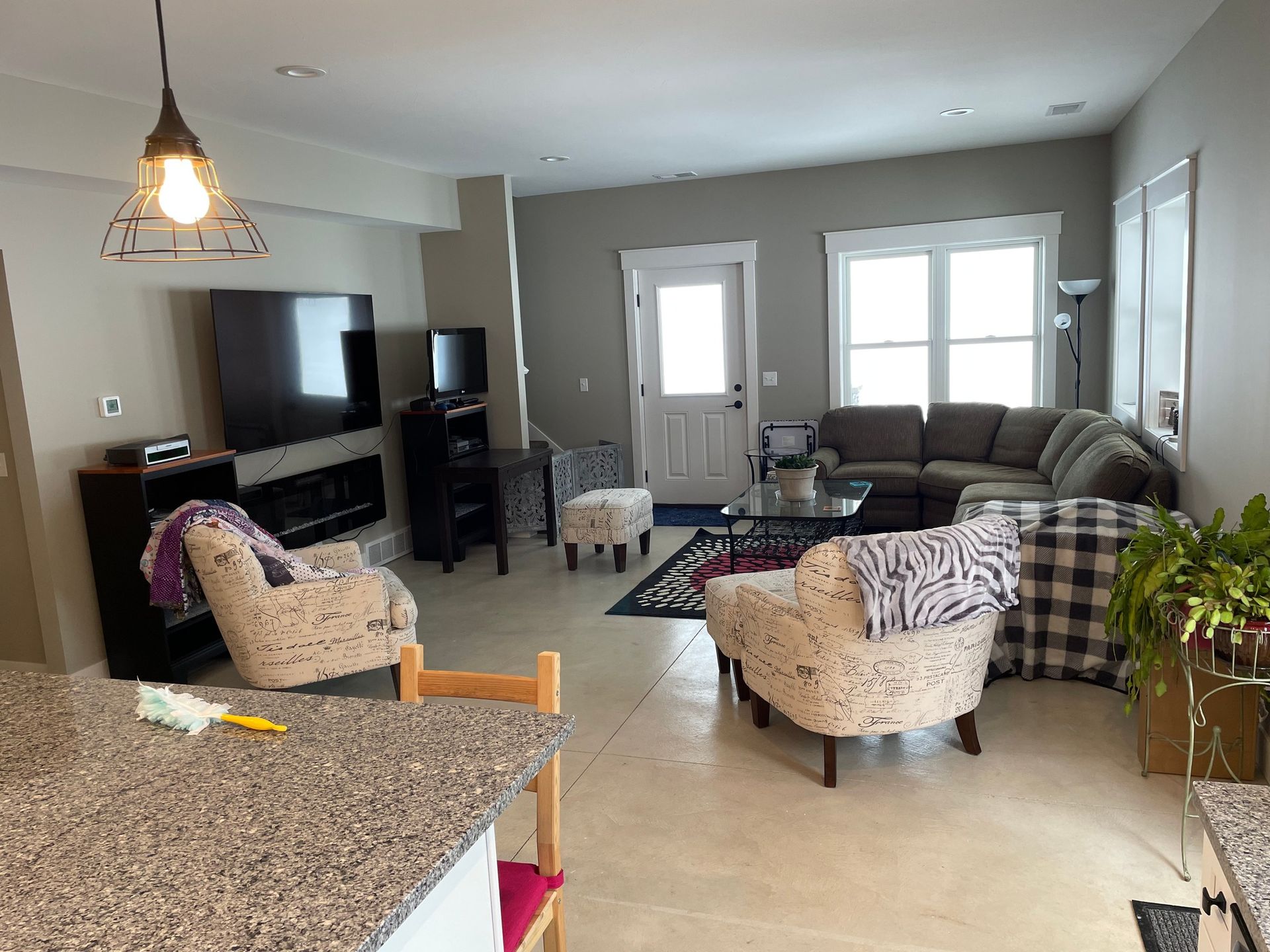 A living room filled with furniture and a flat screen tv.