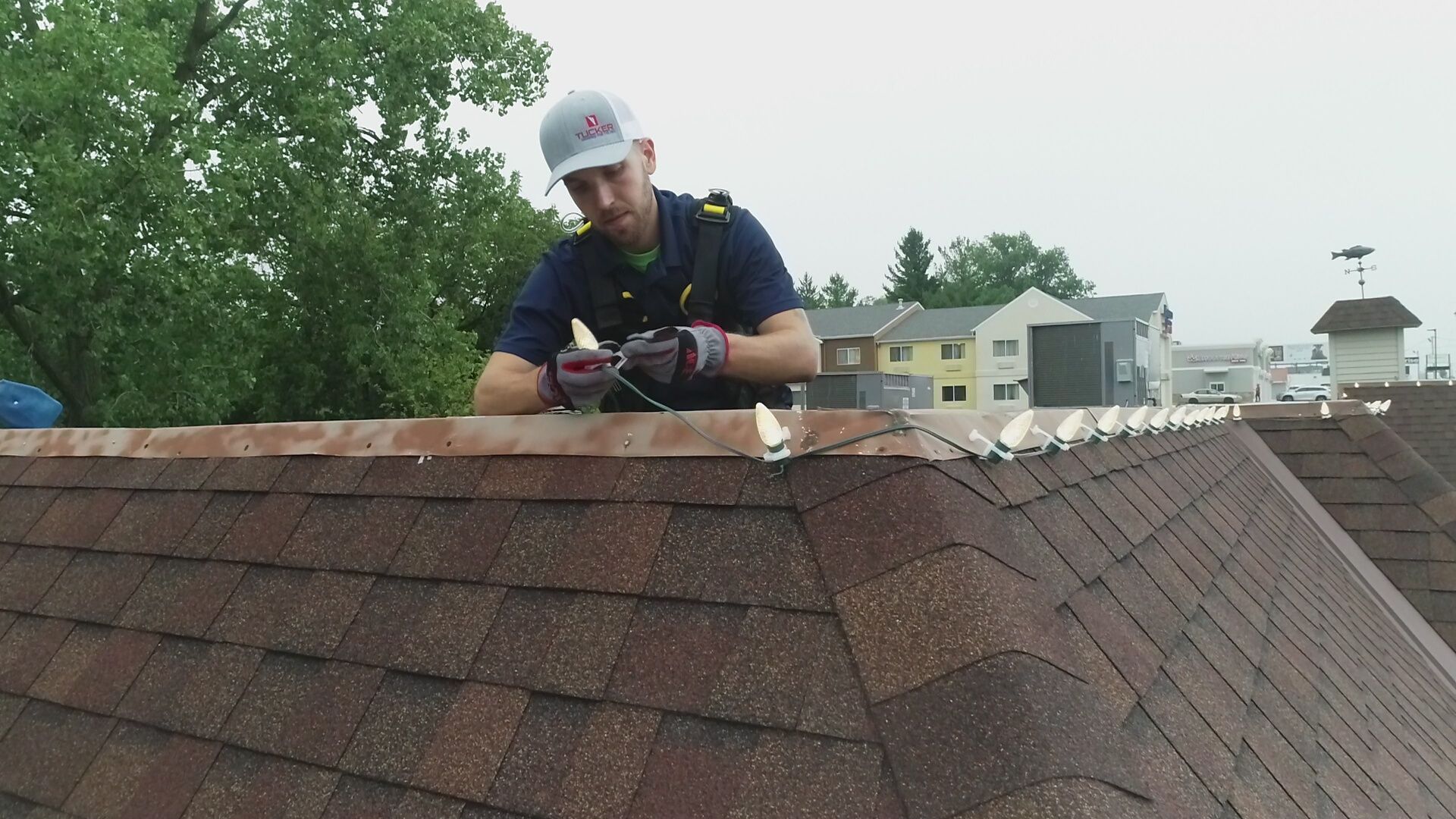 Commercial Christmas light installation on a business roofline in Bradley, Illinois