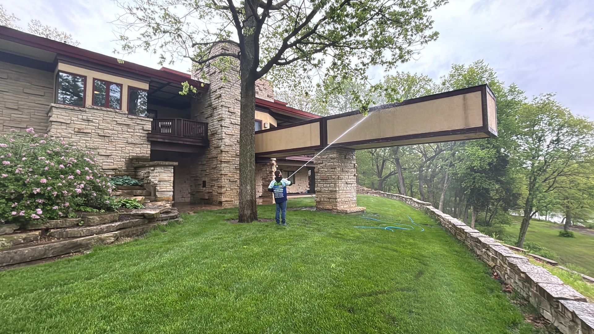 Green Pro Services soft washing a Frank Lloyd Wright inspired home in Bourbonnais Illinois