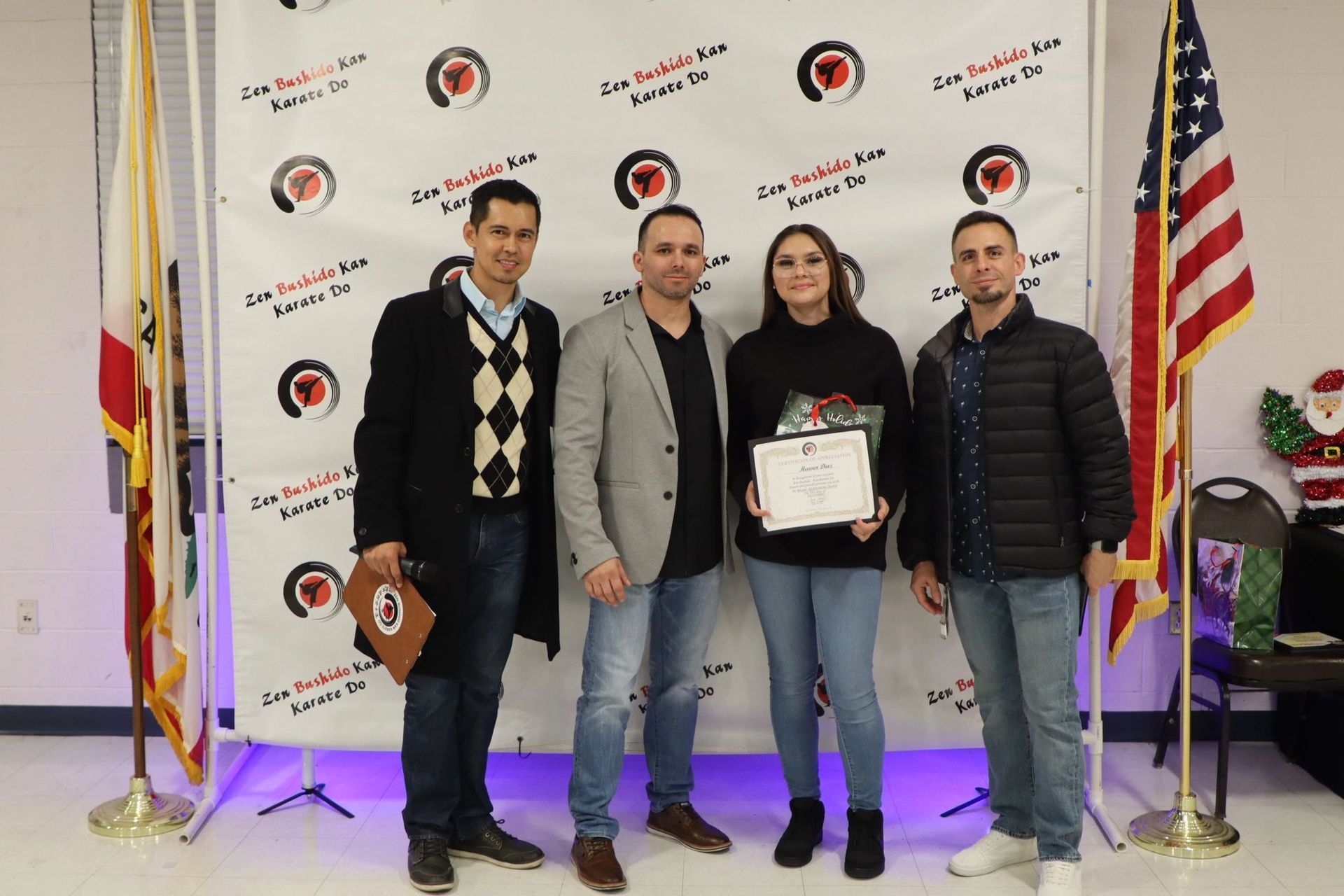 A group of people standing next to each other holding a certificate.