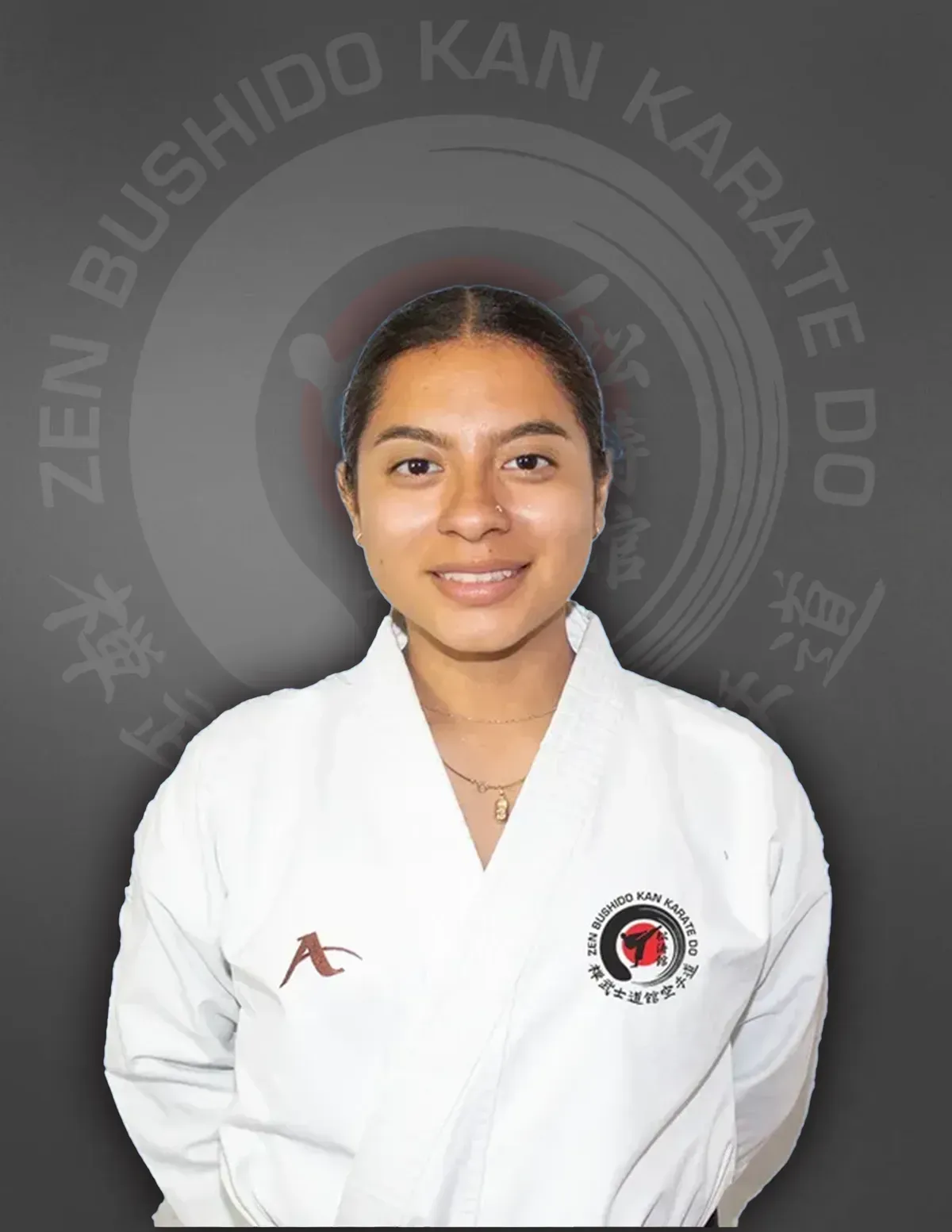 A woman is wearing a white karate uniform