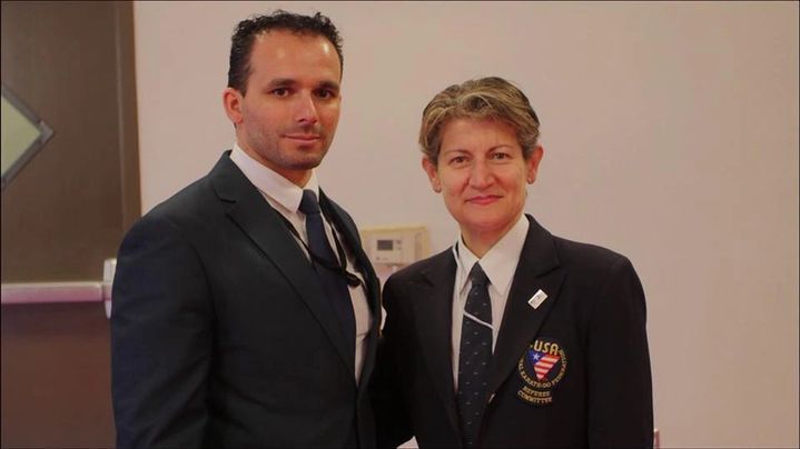 A man and a woman are posing for a picture together