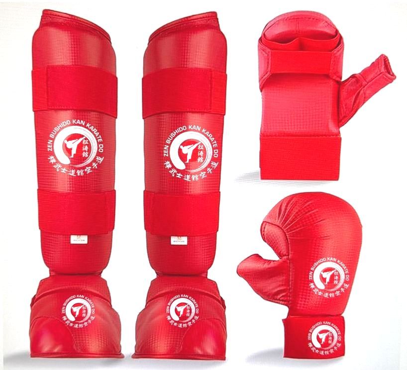A set of red karate gloves and shin guards