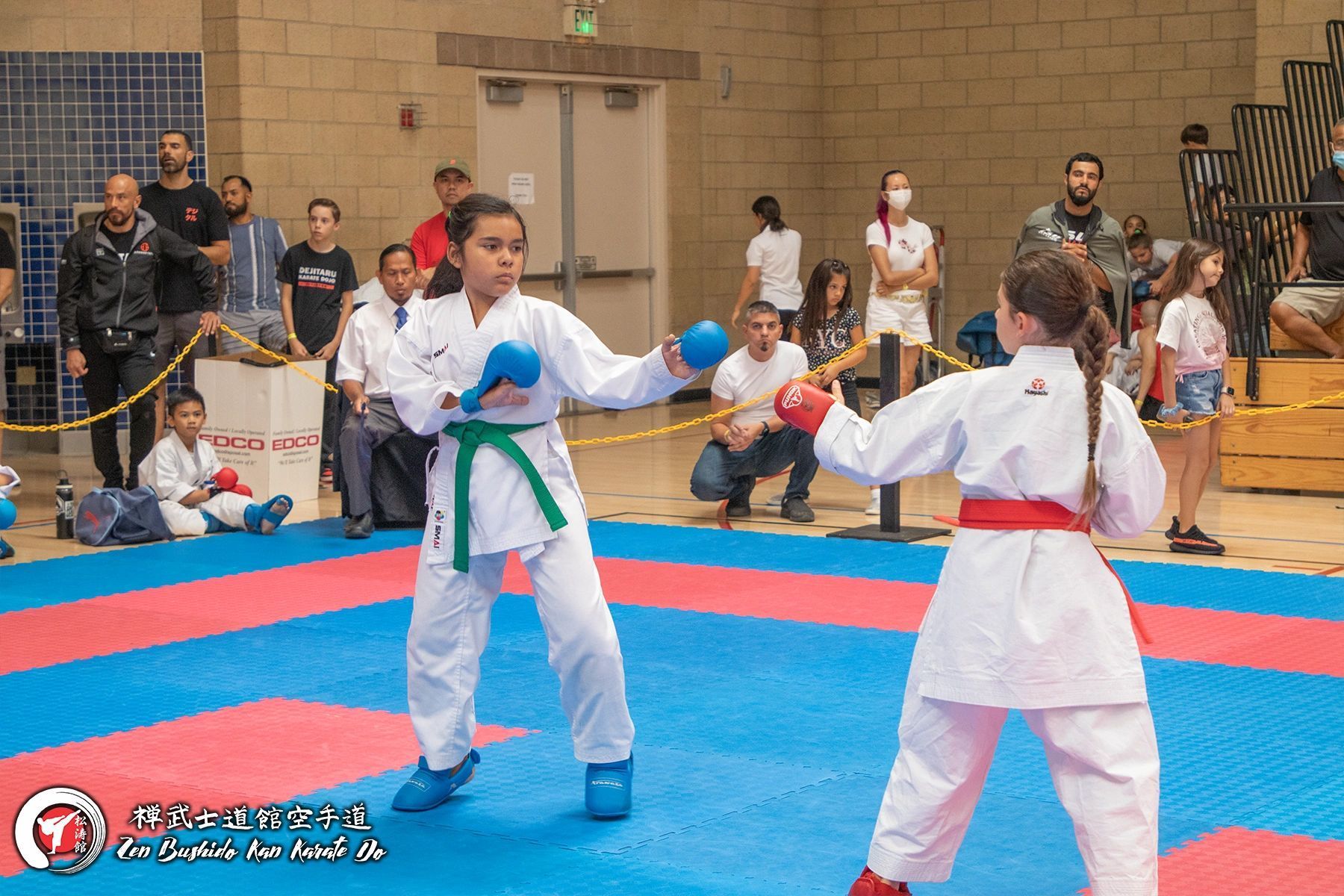 Two karate students are sparring
