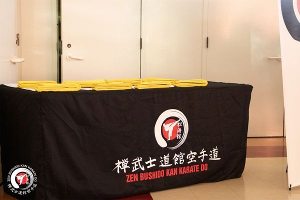 A black table cloth that says zen bushido kan karate on it