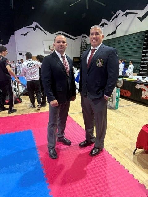 Two men standing together in the official uniforms