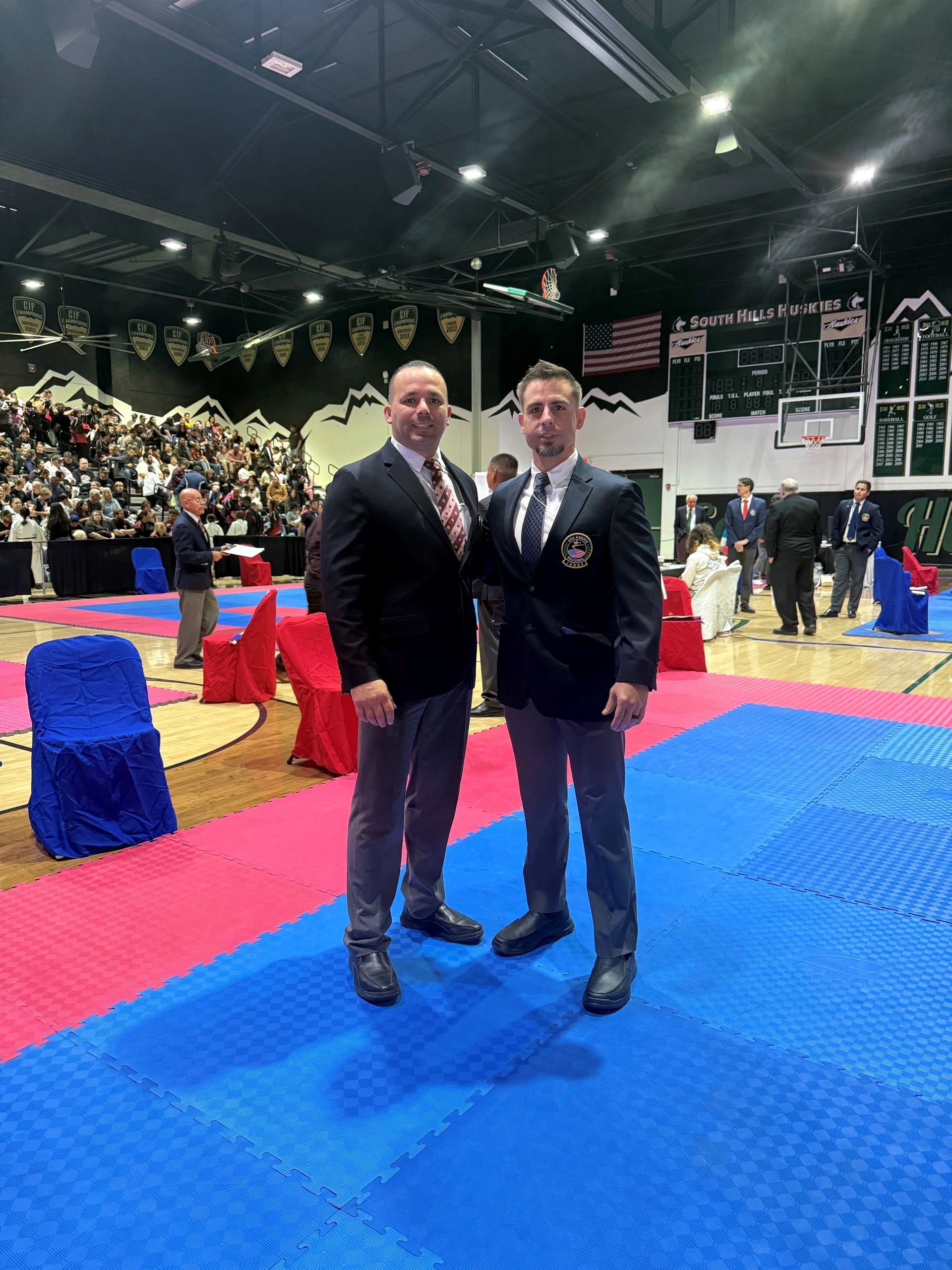 Two men standing together in the official uniforms