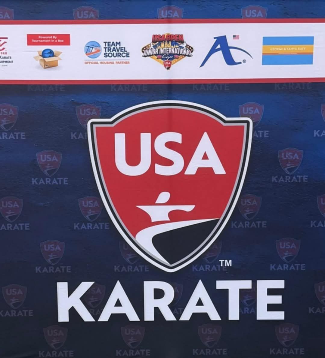 A usa karate logo on a blue background