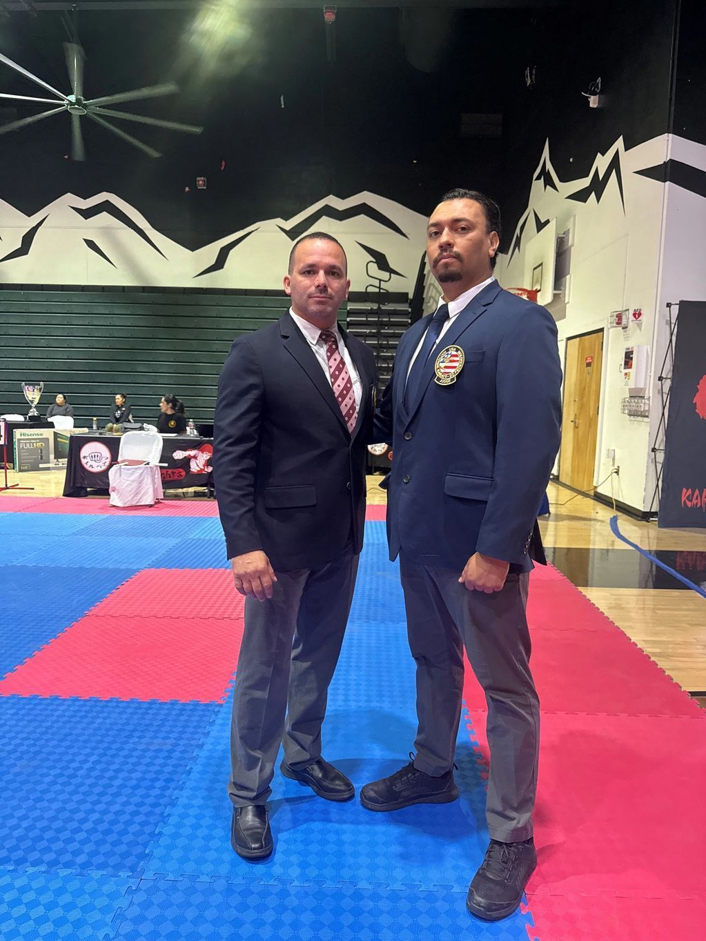 Two men standing together in the official uniforms