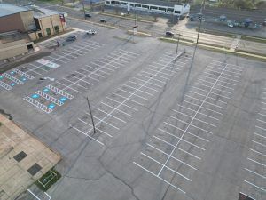 An aerial view of an empty parking lot in a city.