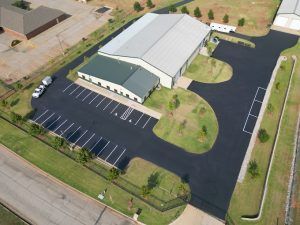 An aerial view of a building and parking lot